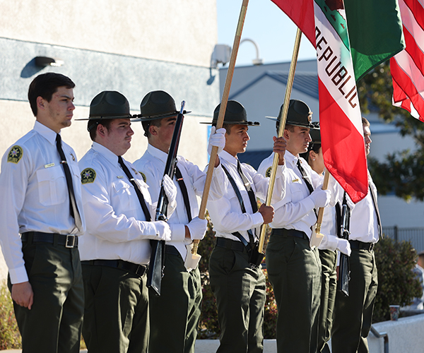 Group of Sheriff's Office Explorers posting the colors.