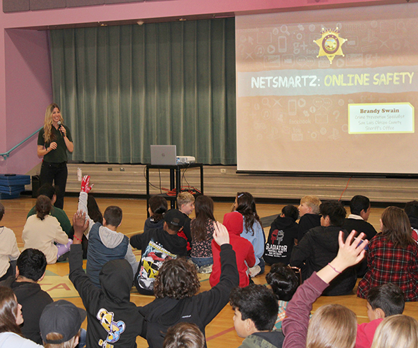 Internet Safety presentation in front of an audience of students.